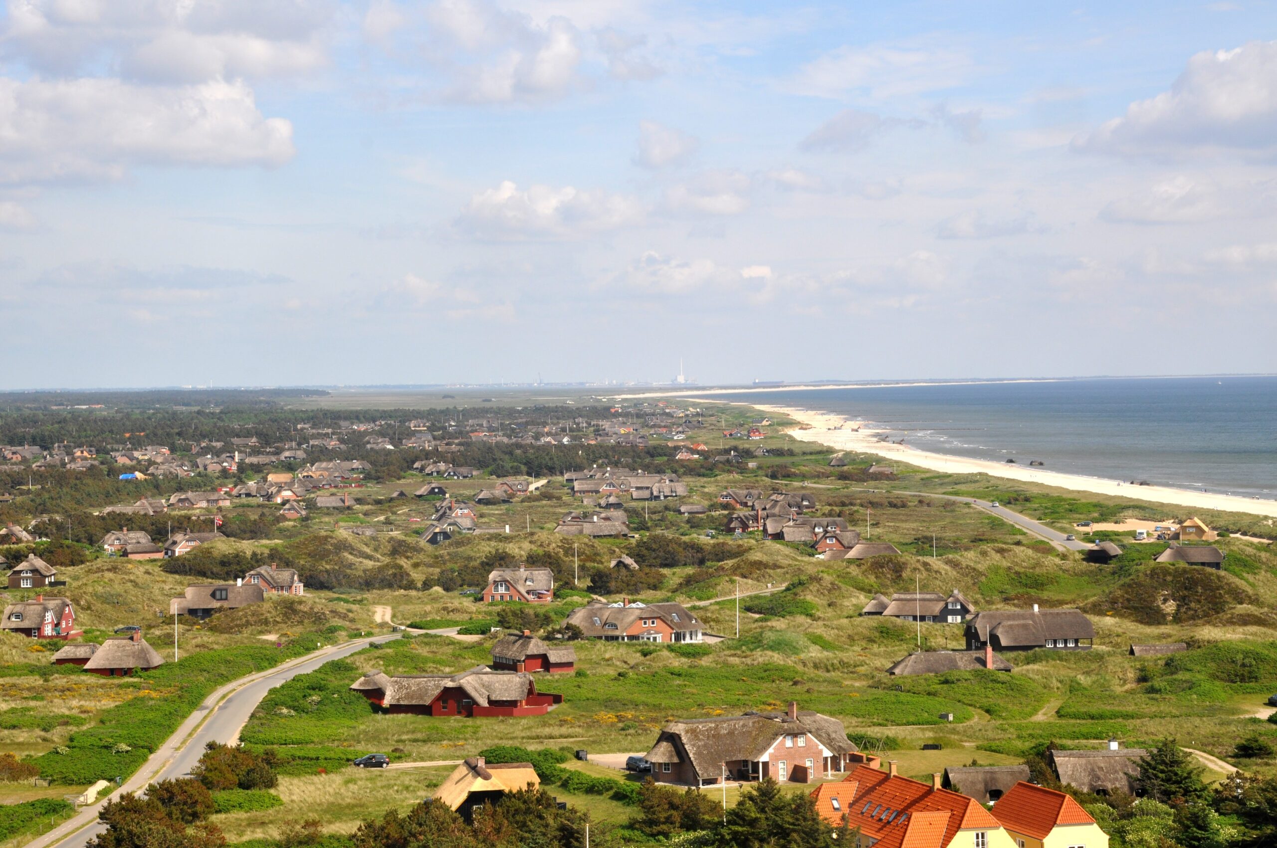 Blavand, Denmark: A beautiful coastal town known for its sandy beaches, scenic dunes, and vibrant lighthouse.