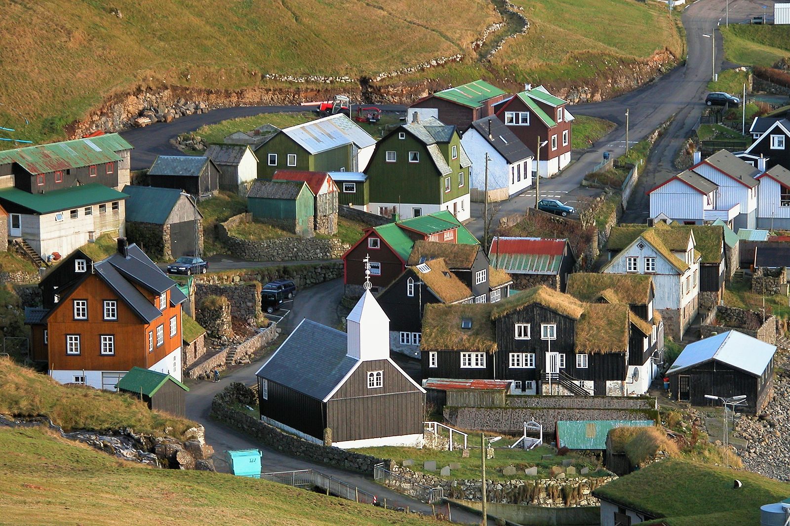 Bour, Vagar Island, Faroe Islands: A picturesque village known for its traditional grass-roofed houses and stunning coastal views.