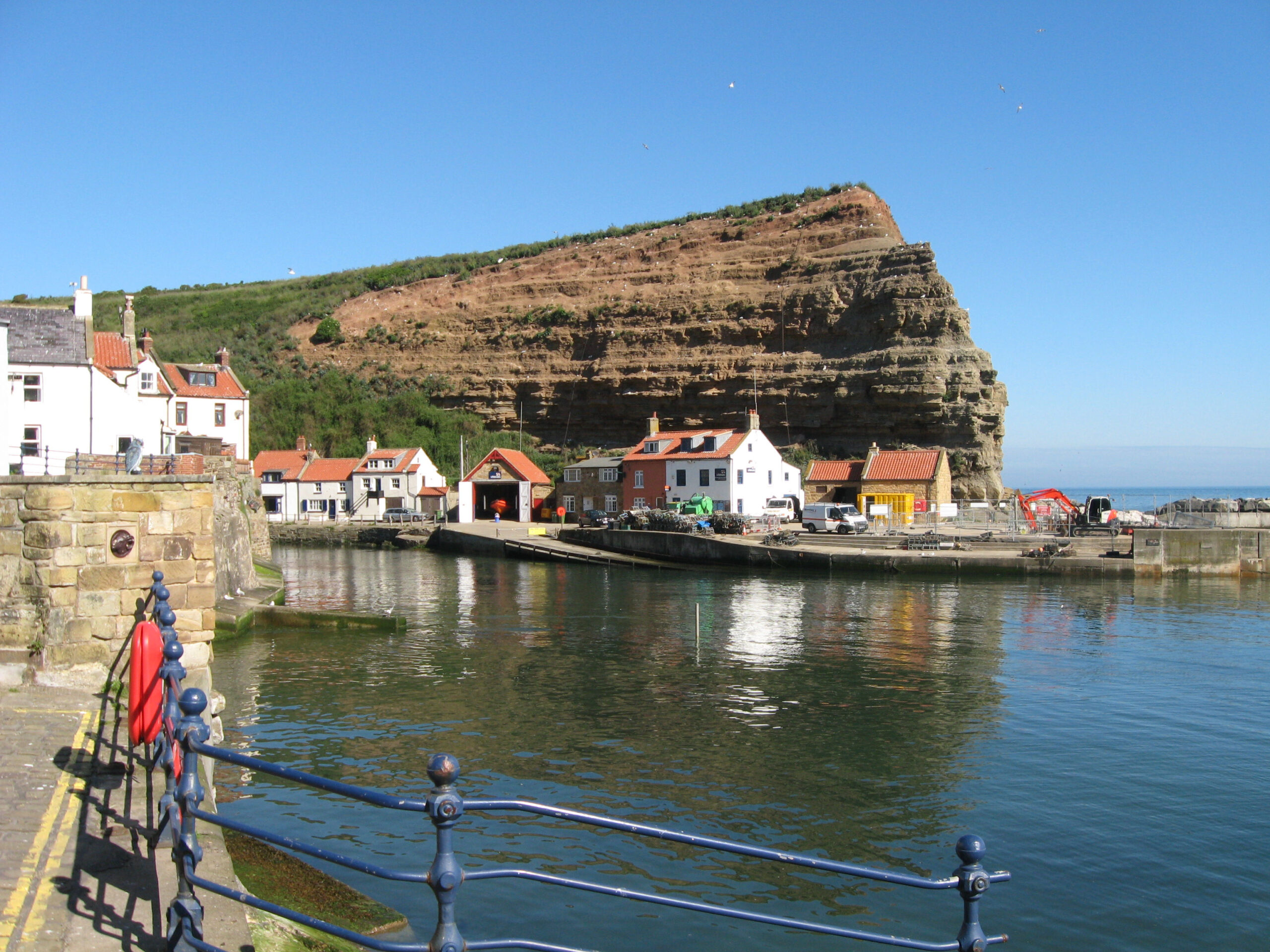 Staithes, North Yorkshire, England: A charming coastal village with historic fishing roots, picturesque cliffs, and artistic heritage.