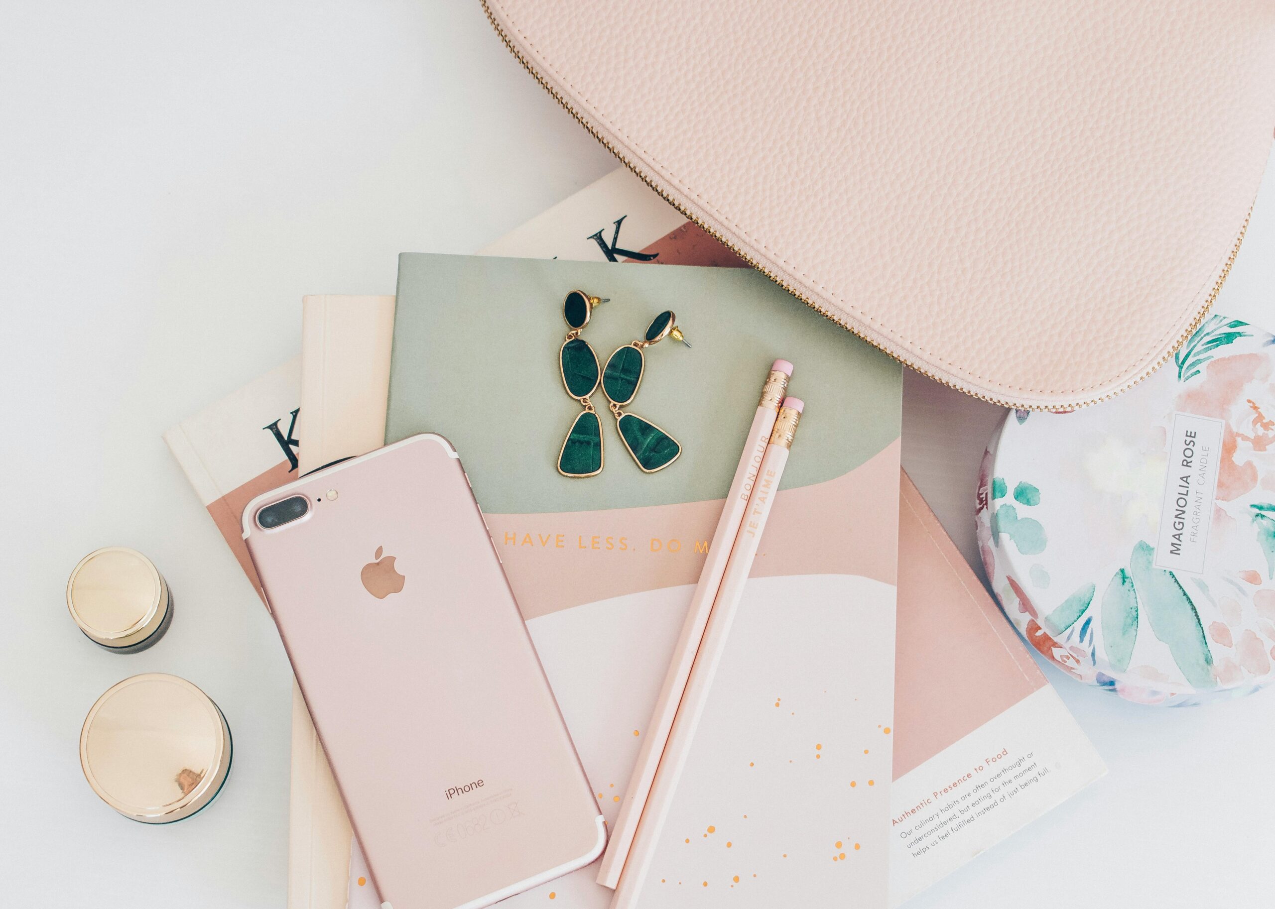 pexels-photo-2897035-2897035 A stylish flatlay featuring rose gold accessories, an iPhone, and a notebook, perfect for a feminine fashion theme.