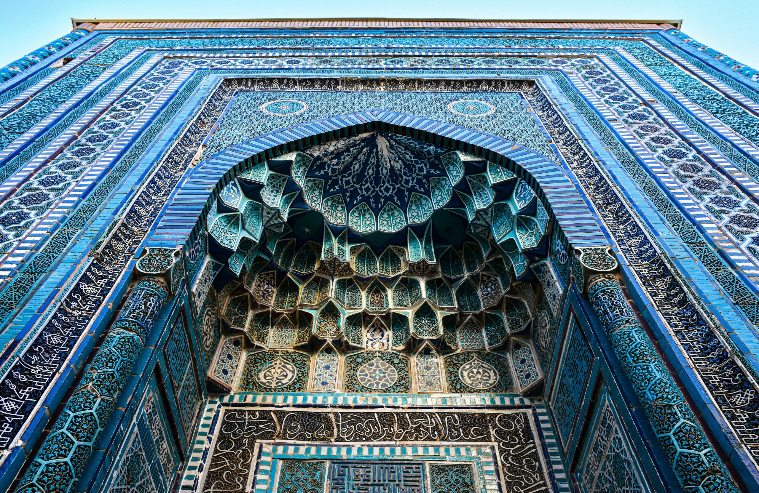 Detailed architectural tile work at Shah-i-Zinda in Samarkand, showcasing Islamic artistry.