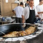 Plov cooked in a large cauldron in Tashkent