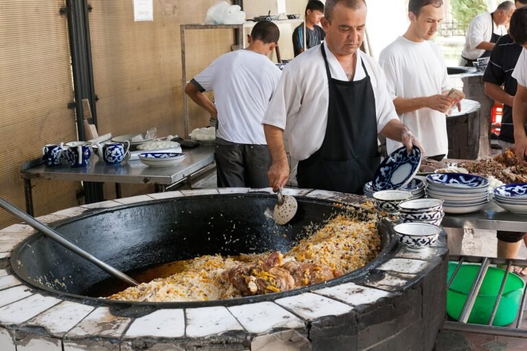 Plov cooked in a large cauldron in Tashkent