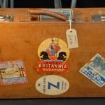 Vintage suitcase with travel labels