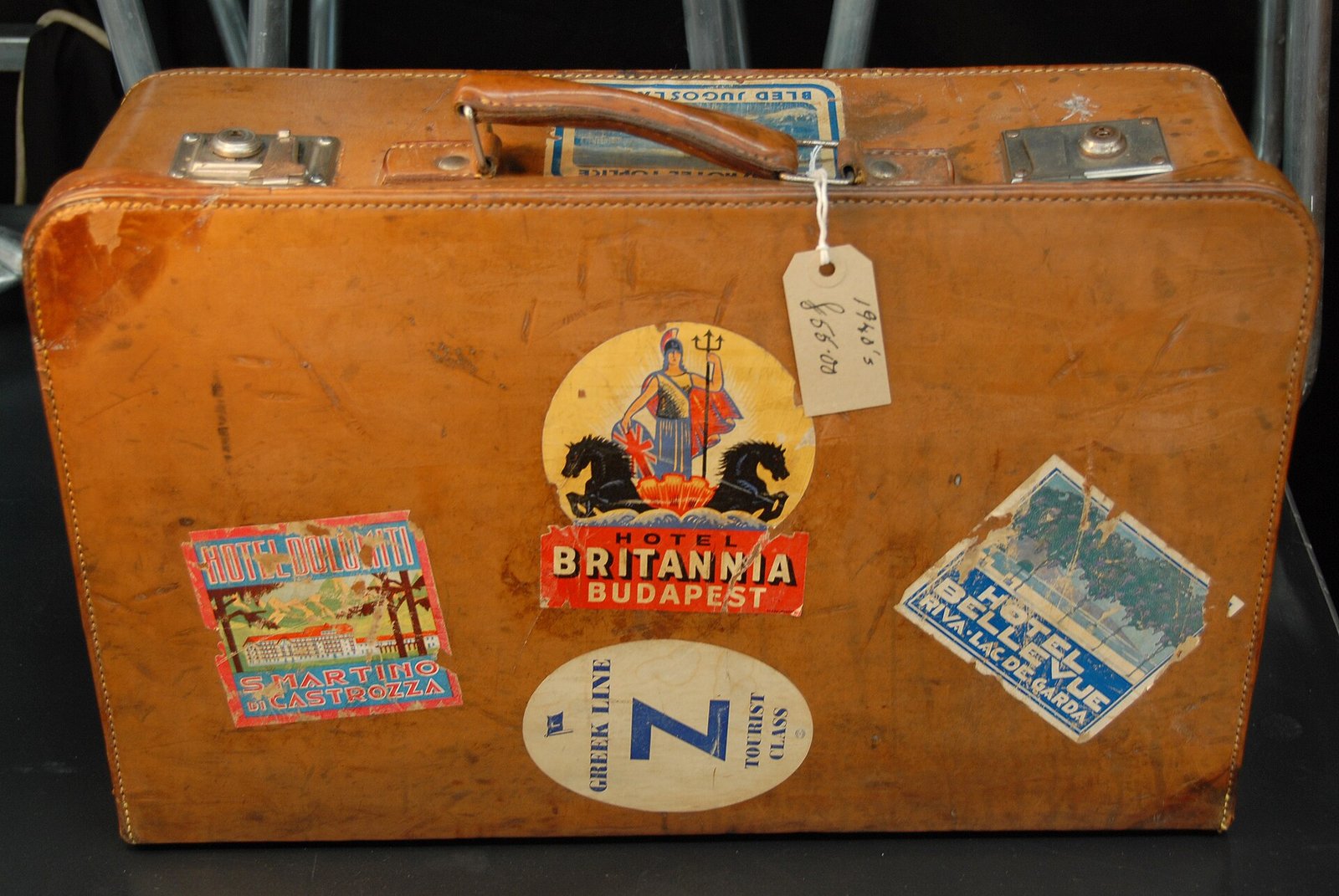Vintage suitcase with travel labels